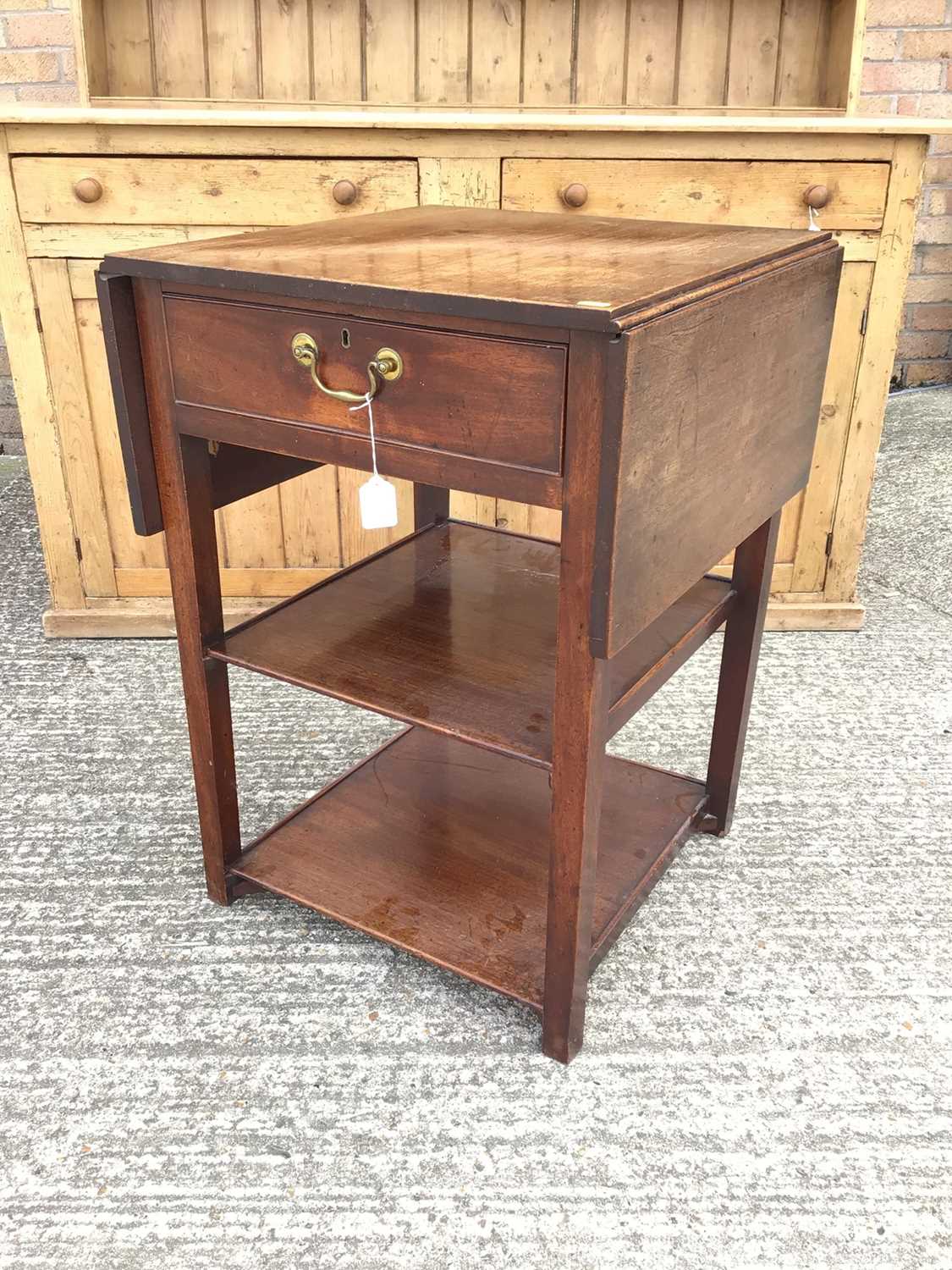 Lot 915 - Georgian mahogany three tier side table, the single drawer flanked by twin drop flaps and two plain tiers below, alterations