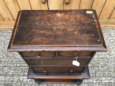 Lot 921 - 18th century-style oak miniature chest on stand with an arrangement of two short and two long drawers, on barley twist stand