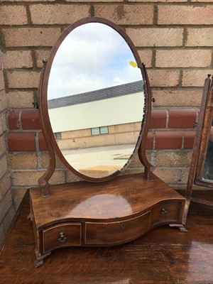 Lot 912 - George III mahogany toilet mirror, the plateau base with three drawers, together with another mirror