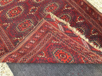Lot 930 - Two Eastern rugs with geometric decoration on red ground 160x104cm, 156x89cm
