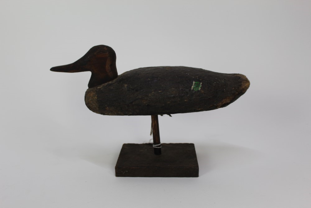 Lot 990 Wooden decoy duck raised on stand