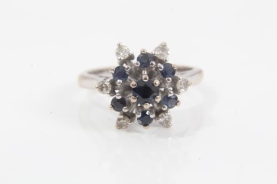 Lot 231 - 18ct white gold sapphire and diamond cluster ring