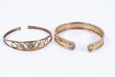 Lot 247 - Two 9ct gold torque bangles