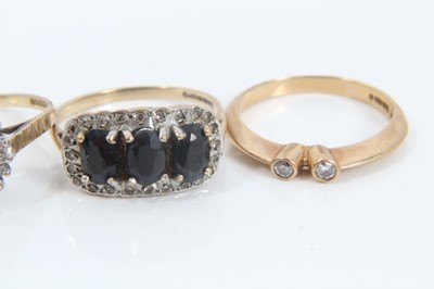 Lot 254 - Four 9ct gold diamond and gem set rings