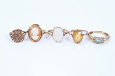 Lot 256 - 9ct gold cameo ring, 9ct gold opal ring, 9ct gold coin ring and two 9ct gold gem set rings (5)