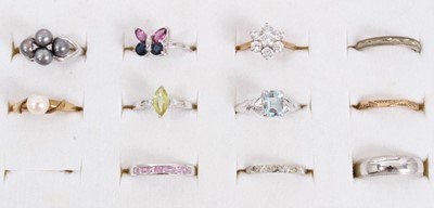 Lot 268 - Group eleven various 9ct yellow and white gold rings within a ring display case