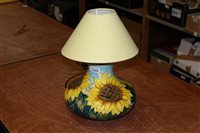 Lot 1189 - Moorcroft pottery lamp with sunflower...