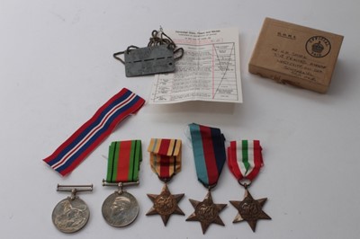 Lot 847 - Second World War Prisioner of War medal group comprising 1939 - 1945 Star, Africa Star, Italy Star, Defence and War medals in box of issue named to Mr. A. H Smirk together with Dog tag stamped 'Sta...