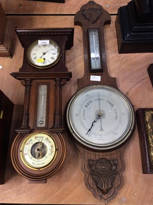 Lot 2362 - Combination clock, barometer and thermometer, manufactured in Wurttenberg, together with a carved oak thermometer and barometer (2)