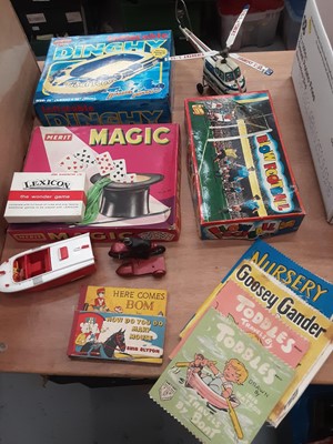 Lot 1654 - Selection of childrens toys, games and books including Enid Blyton, cloth books, blow football, tin plate helicopter etc.