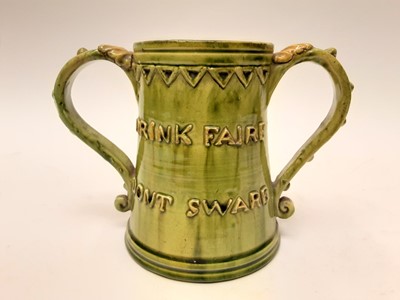 Lot 1131 - Castle Hedingham Edward Bingham green glazed pottery two handled tankard decorated with script - God Save Ye King 1649 and Drink Faire Dont Sware, 14cm high