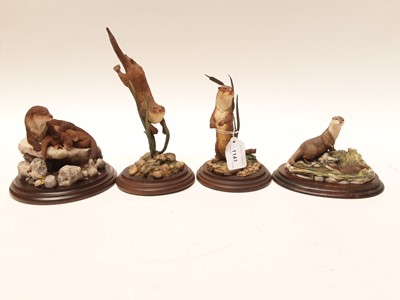 Lot 1141 - Four Country Artists sculptures - Otter Swimming,  Otter Standing, Otter Family and Otter with cub