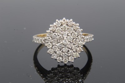 Lot 330 - 18ct gold diamond set oval cluster ring with further diamond set shoulders