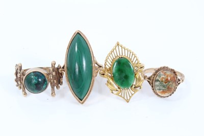 Lot 334 - Two 9ct gold malachite dress rings, 9ct gold green hard stone ring and 9ct gold agate cabochon ring