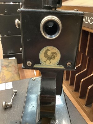 Lot 2452 - Pathé Baby Projector with quantity of film reels, dated 1920s