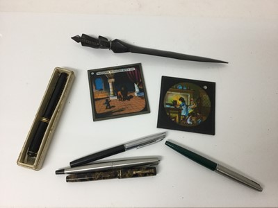 Lot 2382 - Conway Stewart Fountain pen with 14k Gold nib in original cardboard box, a Valentine Fountain pen with 14k Gold nib, three Parker fountain pens, two glass slides and an ebony paper knife