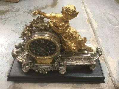 Lot 2416 - 19th century mantel clock, probably French, the clock silver-plated and decorated with floral swags and acanthus scrolls, with gilded black enamel dial, surmounted by an ormolu figure of a woman, o...