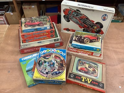 Lot 1752 - Selection of jigsaw puzzles, model car kits and quantity of automobilia books