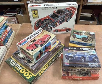 Lot 1752 - Selection of jigsaw puzzles, model car kits and quantity of automobilia books