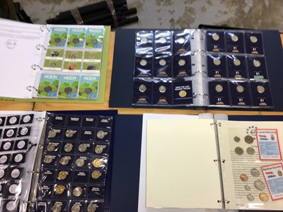 Lot 582 - World - Mixed coins and stamp coin covers in albums to include G.B. £1's, Euro collection and other issues (qty)