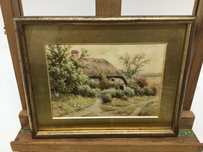 Lot 143 - W Carter, pair watercolours, A cottage garden with a woman holding a basket, signed lower left, and a cottage and garden, signed lower left