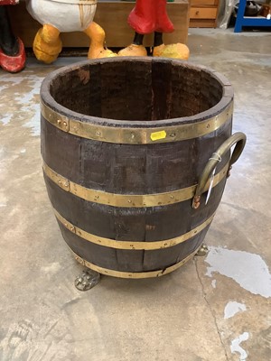 Lot 2451 - Antique brass bound oak log bucket, raised on paw feet