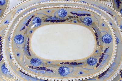 Lot 115 - Early 19th Century Bloor Derby part dinner service with blue floral and gilt borders.