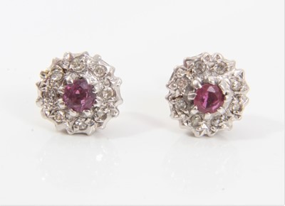 Lot 540 - Pair of ruby and diamond cluster earrings