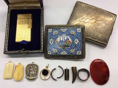 Lot 746 - Dunhill gold plated lighter in case, Eastern enamelled cigarette case, one white metal cigarette case, various pendants etc