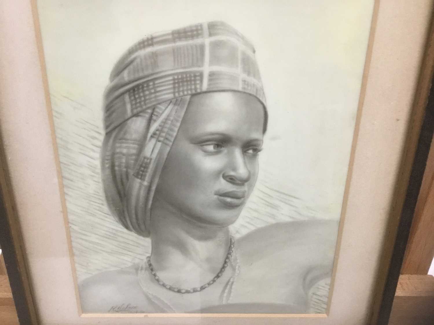 Lot 173 - 1950s ink and watercolour on ivorine panel - portrait of a young African lady, signed and dated '53, 17.5cm x 13cm, in glazed frame