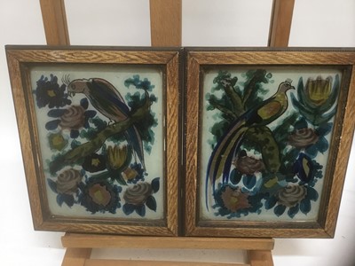 Lot 294 - Pair of early 20th century reverse painted pictures on glass depicting exotic birds among foliage, 27cm x 22cm overall