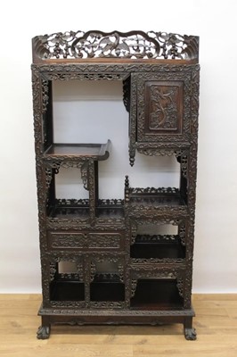 Lot 1423 - Late 19th century Chinese carved rosewood display cabinet