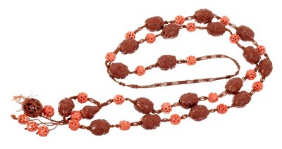 Lot 534 - 19th century Chinese carved coral bead and carved hediao nut necklace