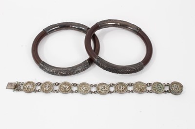 Lot 536 - Two 19th century Chinese carved bamboo and silver mounted bangles and a Chinese silver bracelet