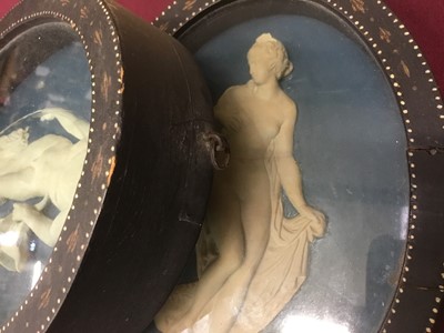 Lot 788 - Pair of late 18th/early 19th century composition oval relief plaques depicting classical figures, in oval painted frames