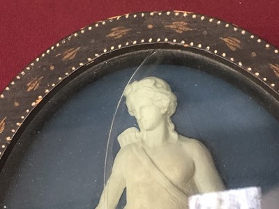 Lot 788 - Pair of late 18th/early 19th century composition oval relief plaques depicting classical figures, in oval painted frames