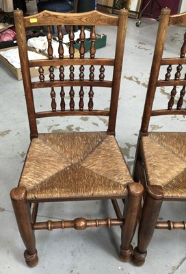 Lot 851 - Set of four 19th century style Lancashire spindle back chairs with rush seats on turned legs and stretchers