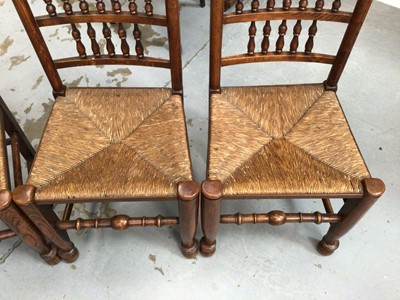 Lot 851 - Set of four 19th century style Lancashire spindle back chairs with rush seats on turned legs and stretchers
