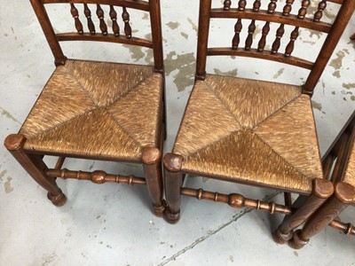 Lot 859 - Set of four 19th century style Lancashire spindle back chairs with rush seats on turned legs and stretchers