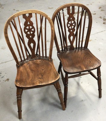Lot 853 - 19th century Windsor elbow chair and a set of four Windsor wheel back kitchen chairs with solid seats on turned legs