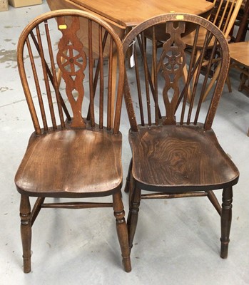 Lot 853 - 19th century Windsor elbow chair and a set of four Windsor wheel back kitchen chairs with solid seats on turned legs