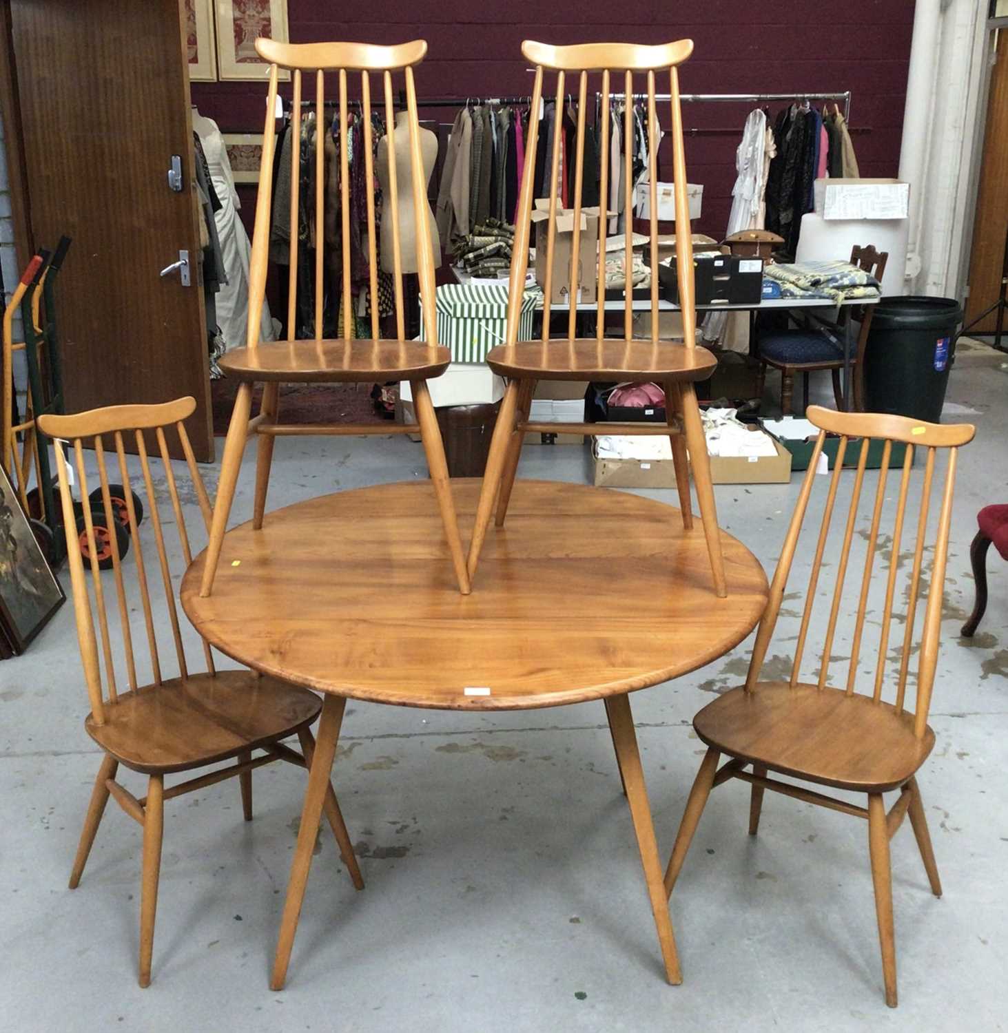 Lot 852 - Ercol Golden Dawn drop leaf table and set of four Ercol stick back chairs