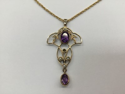 Lot 687 - Edwardian style 9ct gold amethyst and seed pearl pendant on chain