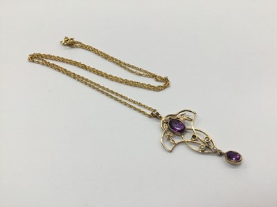 Lot 687 - Edwardian style 9ct gold amethyst and seed pearl pendant on chain