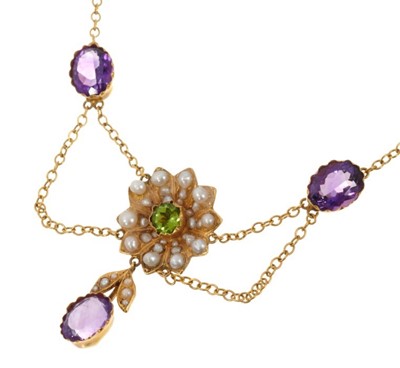 Lot 499 - Edwardian style suffragette reference gold peridot, amethyst and seed pearl pendant necklace