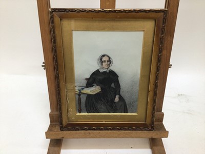 Lot 30 - Trio of mid 19th century pencil, pastel and watercolour portraits depicting members of the Carteret Carey family, a gentleman seated in a Regency chair and lady's seated in interiors, each indistin...