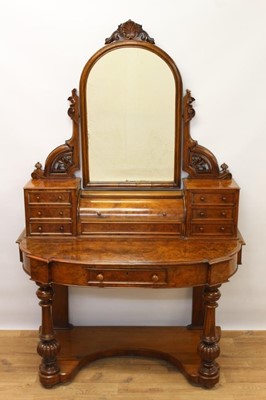 Lot 1420 - Victorian burr walnut veneered dressing table with arched mirror with jewellery compartment enclosed by cylinder top, flanked by six further jewellery drawers, the bow front with further drawer on...