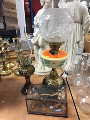 Lot 340 - Early 20th century oil lamp, together with another oil lamp and a Chinese diorama (3)