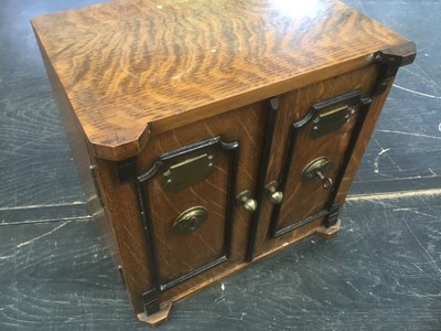 Lot 137 - Good quality Edwardian oak table cabinet, in the form of a safe, with three short drawers enclosed by two locking doors, 25cm wide
