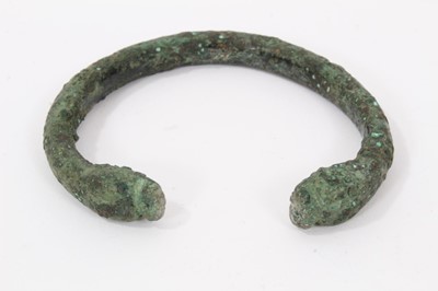 Lot 741 - Ancient bronze bangle, probably Roman, with animal head terminals